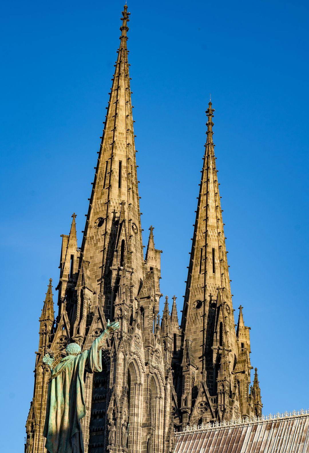 a large cathedral with a statue on top of it